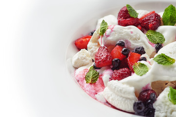 delicious ice cream with fruit and pieces of meringue