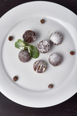 candy hand cooking on a white plate
