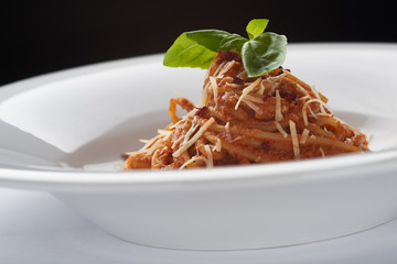 Spaghetti Bolognese with Basil Leaf and parmesan
