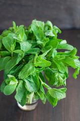 fresh mint leaves on a wooden background