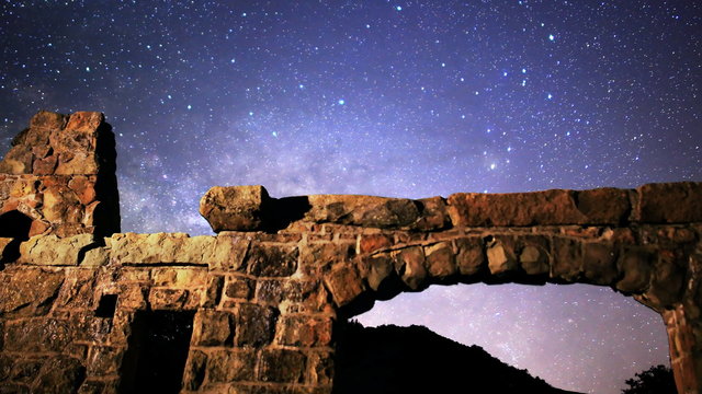  Astrophotography time lapse footage of milky way galaxy rising over abandoned brick ruin structure at Knapp's Castle in Santa Barbala, California -Long Shot-