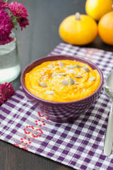 Pumpkin cream-soup with seeds in a bowl