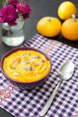 Pumpkin cream-soup with seeds in a bowl