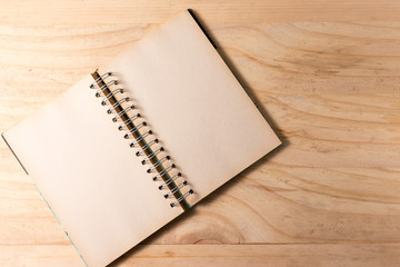open book with blank pages on wooden background