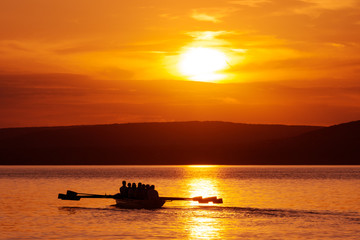 Rowing boat at sunset on Balaton lake