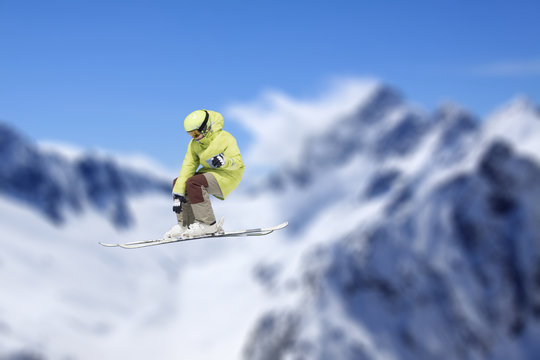 Flying skier on mountains