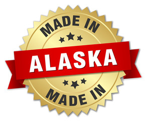 made in Alaska gold badge with red ribbon