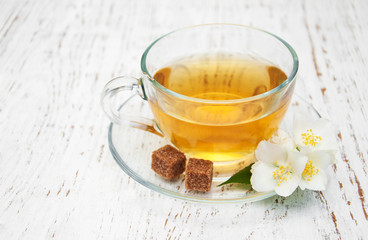 Cup of tea with jasmine flowers