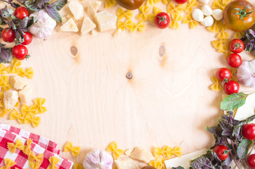 Fototapeta na wymiar Rustic wooden food background with italian food ingredients