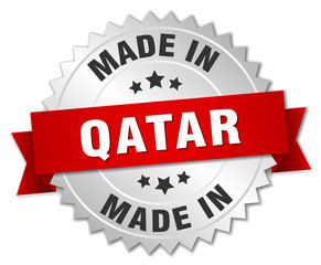 made in Qatar silver badge with red ribbon