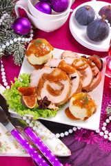 christmas dinner with loin of pork stuffed with figs and potato