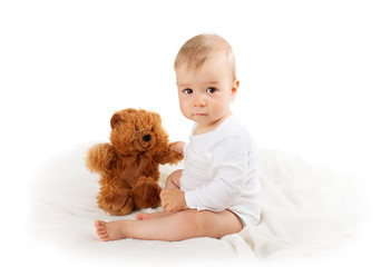 Little baby isolated on white background with plush toy