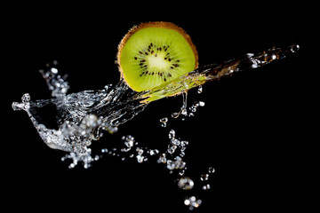 Kiwi slice and water splash © Vitaliy