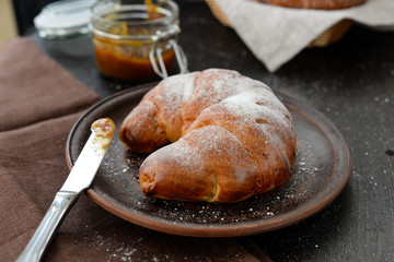 delicious breakfast with fresh croissants and jam