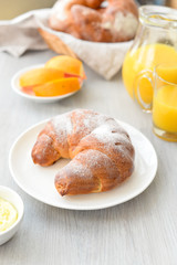 delicious breakfast with fresh croissants and orange juice