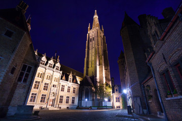 Fototapeta premium Church of Our Lady Bruges from cobblestone road
