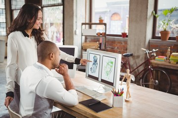 Man and woman discussing over design