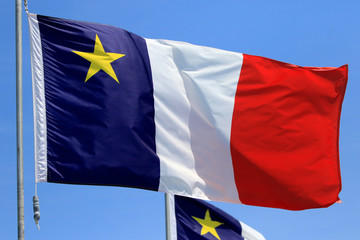 Acadian Flag with Blue Sky Background, Newfoundland, Canada
