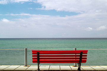 Small red bench overlooking the Aegean sea - 92172730