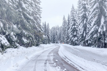 Snowy winter road in Julian Alps