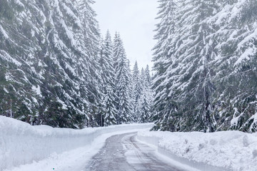 Snowy winter road in Julian Alps