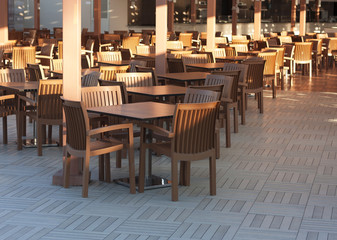 Wooden tables in a outdoor restaurant photo