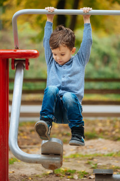Cute little boy have a good time in park playground
