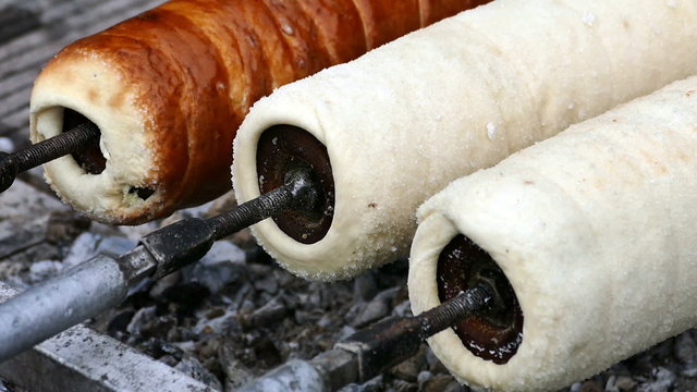 Hungarian Kurtoskalacs prepared on the grill, at a traditional food fair. Specific for Transylvania, Romania.