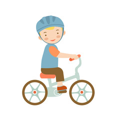 Cute little boy riding a bike 