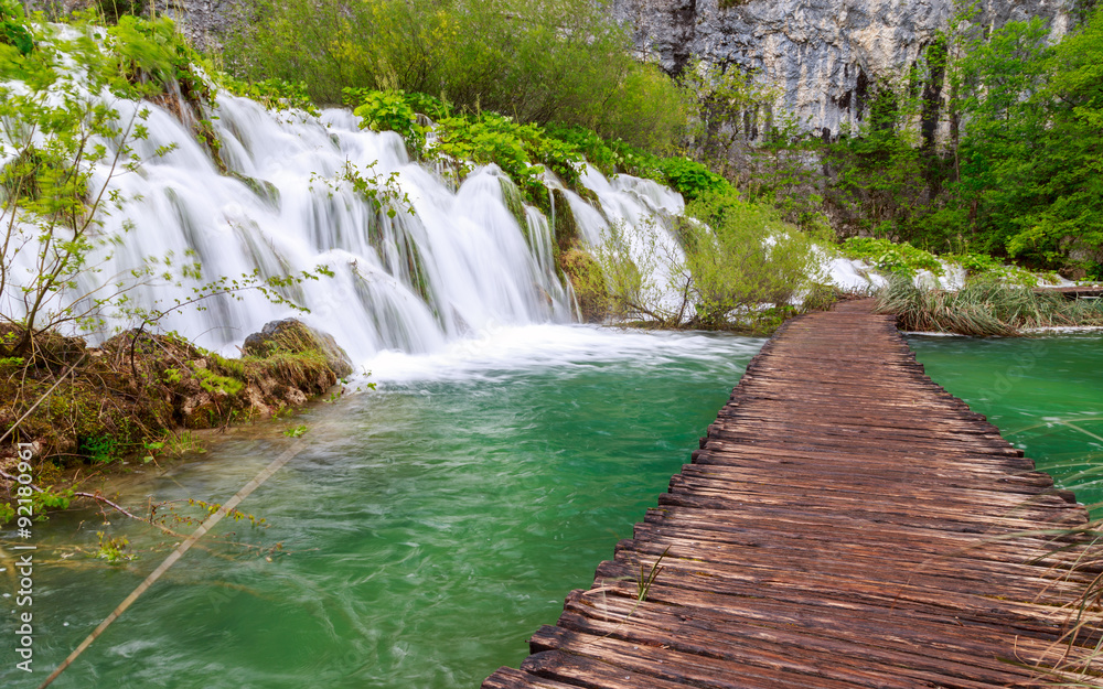 Wall mural wooden path in national park in plitvice