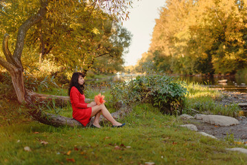 Beautiful middle aged woman in the autumn forest