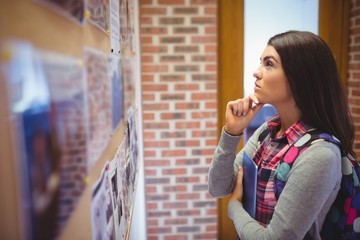 Pretty woman reading notice