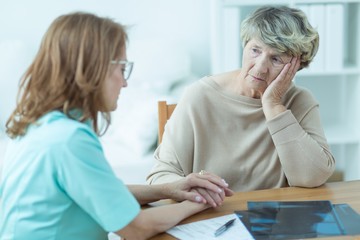 Consoling old patient © Photographee.eu