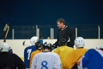 Fototapeta premium ice hockey players team meeting with trainer