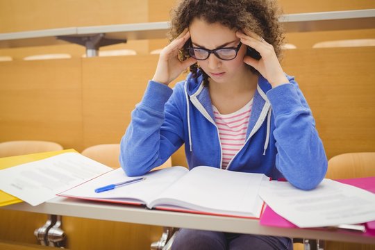 Stressed student in lecture hall