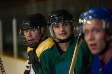 ice hockey players on bench