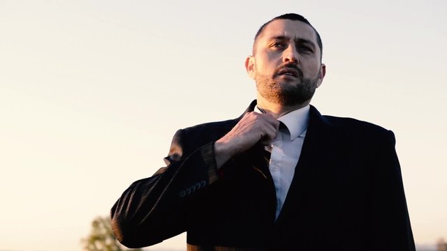Concept: A frustrated business man is leaving the corporate lifestyle and chasing freedom in the outback of Queensland, Australia. Cinematic Portrait Style.