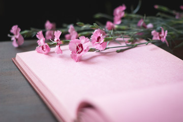 Pink vintage photo album page with flowers