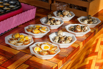 Fresh fried quail eggs. Traditional thai walking street food cui
