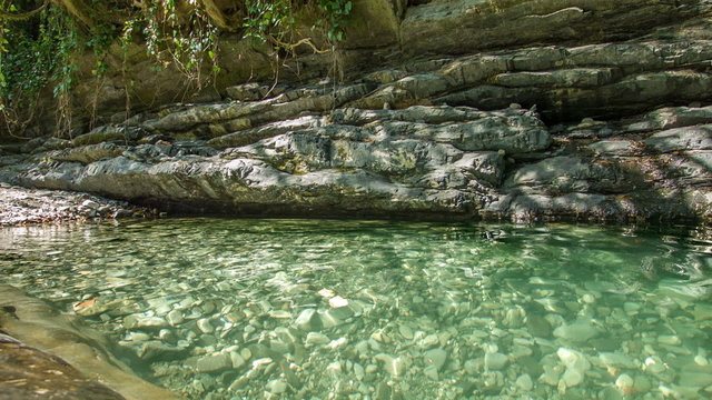 Rocks lake in forest with clear water 2
