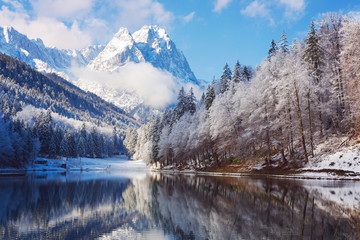 Winter landscape with lake and reflection