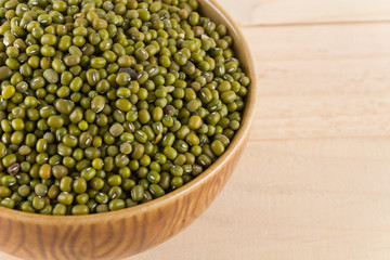 green beans on wood background