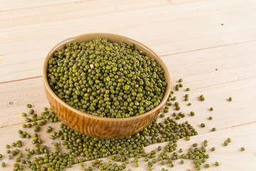 green beans on wood background
