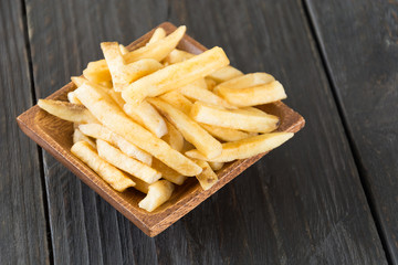 french fries on wood background