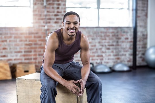  Man sitting on plyo box