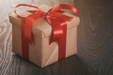 rustic gift box with red ribbon bow
