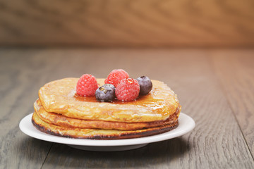 Pancakes with raspberry, blueberry and maple syrup