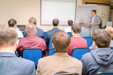 Fototapeta premium Speaker at Business Conference and Presentation. Audience at the conference hall.