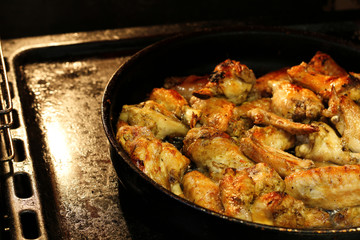 Chicken wings are baked in the oven