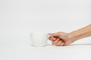 Fototapeta na wymiar hand sign posture hold coffee cup in isolated